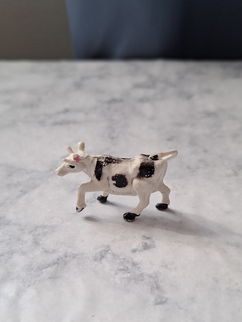 Miniature Black and White Cow Figurine
